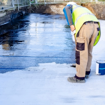 Application of reinforced liquid acrylic waterproofing coating on a residential roof