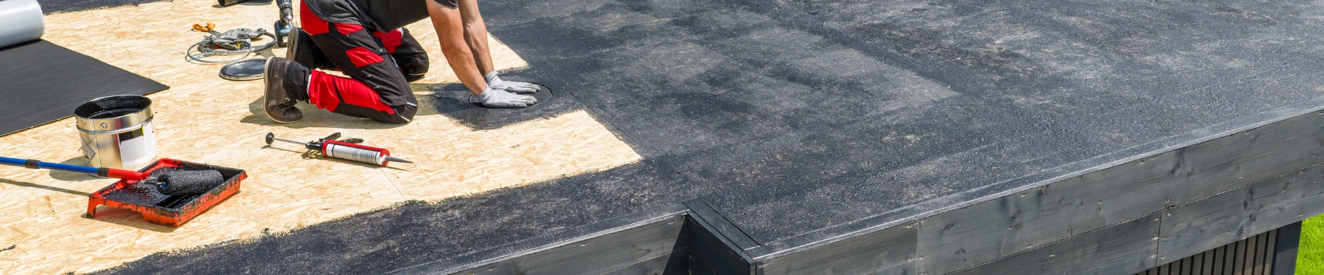 Professional roof painting and surface restoration on an estate home in River Club